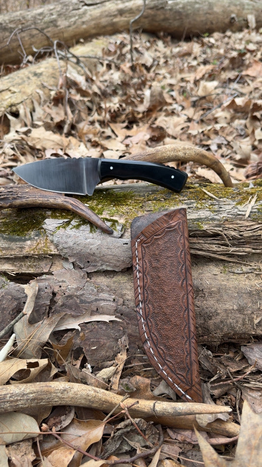 Signature blade with Black paper micarta W/white G10 pins