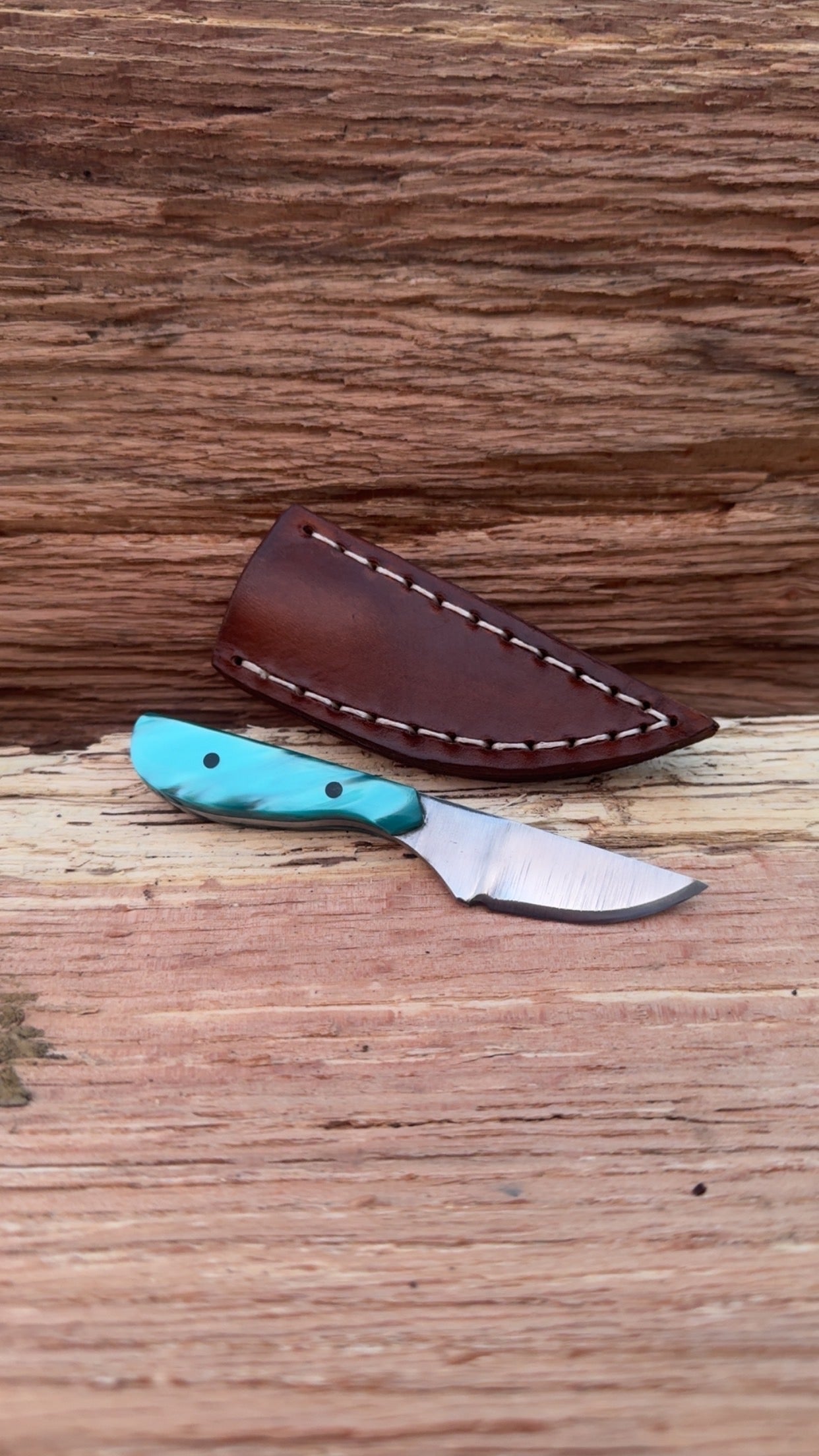 Slim pocket carry with aqua marine handle